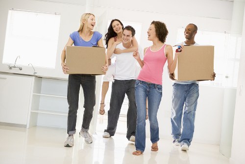 Professional movers loading a van for a Kingston Vale home move
