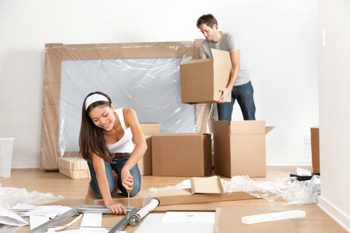 Removal team preparing a move in Kingston Vale residential street