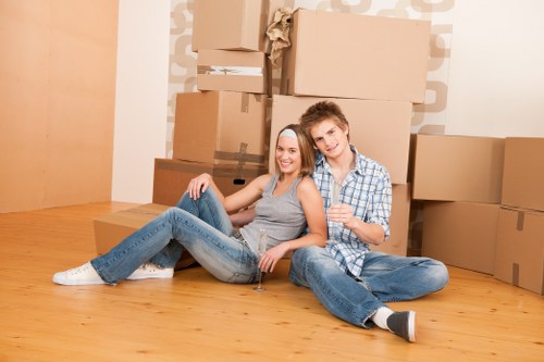 Movers handling household items with care during a Kingston Vale relocation