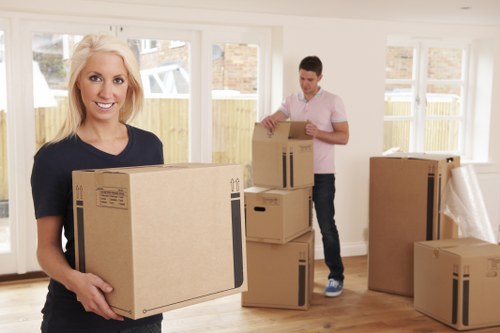 Packed boxes and furniture ready for transport in Kingston Vale