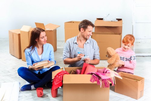 Packed boxes and furniture ready for transport during a Kingston Vale removal