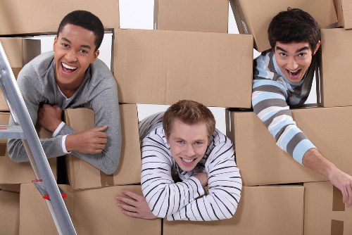 Packed moving boxes and furniture for a Kingston Vale home relocation