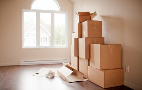 Professional movers loading items into a removal truck in Kingston Vale