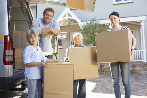 Careful loading of large furniture items for collection