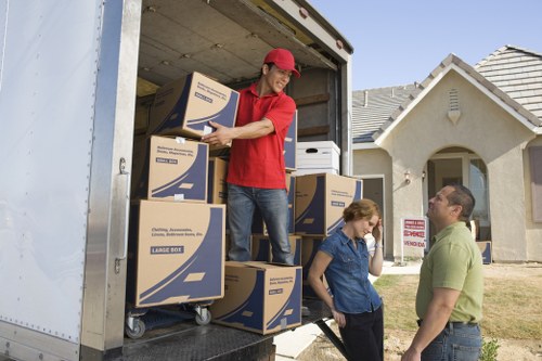 Packed boxes and furniture ready for transport by local movers