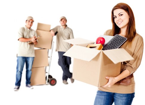 Loading boxes and furniture carefully into a moving van