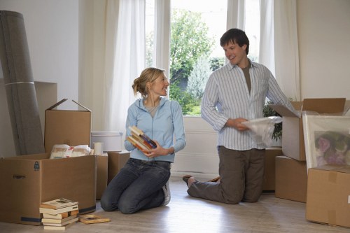 Professional movers loading household items for a Kingston Vale relocation