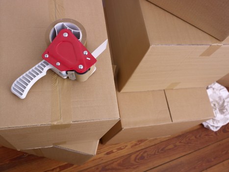 Furniture and household items being loaded into a van